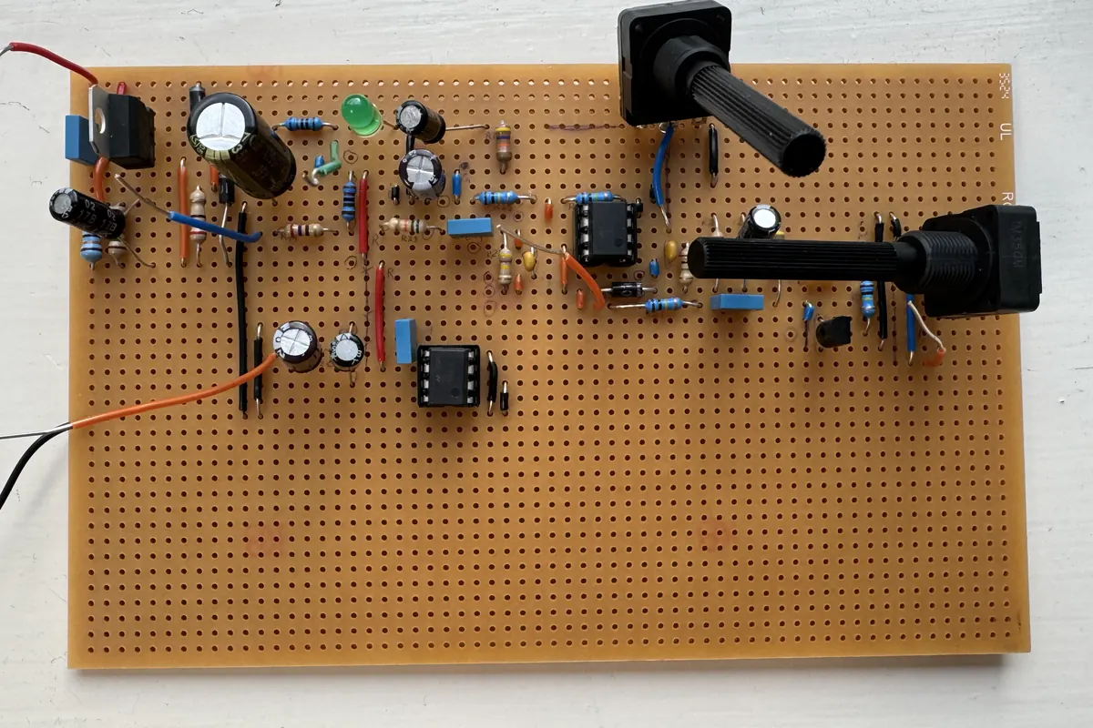 Multi-stage audio amplifier hand-built on stripboard with two potentiometers.