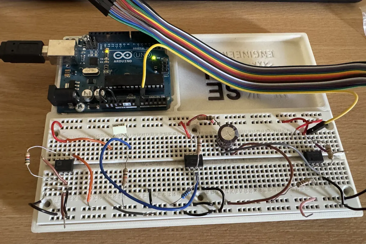 EMG acquisition circuit built on a breadboard, wired to an Arduino Uno.